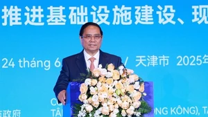 Le Premier ministre Pham Minh Chinh s'exprime lors du Forum des entreprises Chine-Vietnam. Photo: VNA.