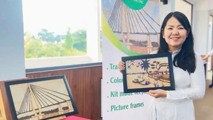 Tran Thi Hien Triet et ses peintures de riz impressionnantes.
