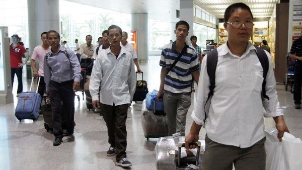 Des travailleurs vietnamiens en République de Corée. Photo: VNA.