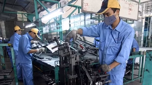 L'AEC aiderait le Vietnam comme les autres pays de l'ASEAN à se développer plus rapidement, à créer de l'emploi, à attirer davantage l'investissement étranger. Photo: VNA.