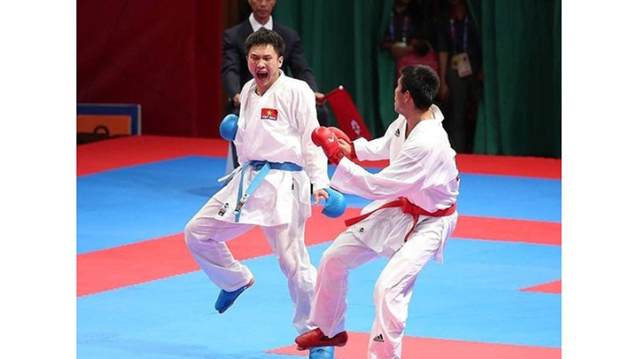 Le karatéka Nguyên Minh Phung (ceinture bleue). Photo : VNA