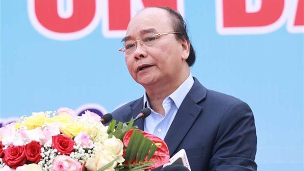 Le Président Nguyên Xuân Phuc lors de la cérémonie de plantation d'arbres. Photo : VNA.
