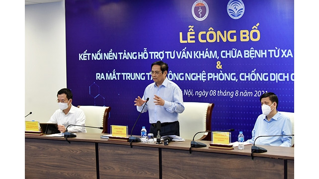 Le Premier ministre Pham Minh Chinh prend la parole lors de la cérémonie. Photo : NDEL.