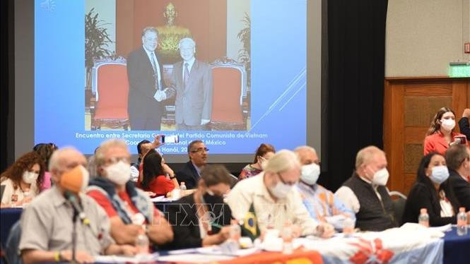 Le message du Secrétaire général du PCV, Nguyen Phu Trong est prononcé lors du colloque. Photo : VNA