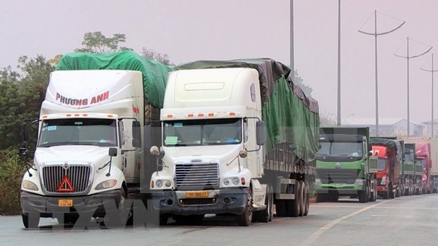 Les marchandises vietnamiennes sont exportées en Chine via la poste-frontière de Mong Cai. Photo : VNA.