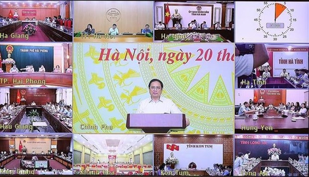 Le Premier ministre Pham Minh Chinh lors de la conférence, à Hanoi, le 20 août. Photo : VNA.