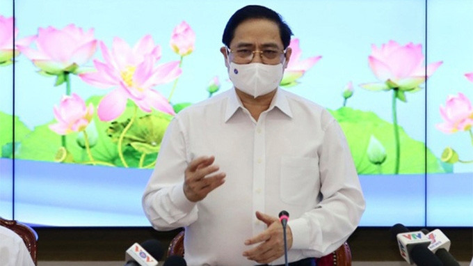 Le Premier ministre Pham Minh Chinh prend la parole lors de la séance de travail avec les autorités de Hô Chi Minh-Ville. Photo : TTO.