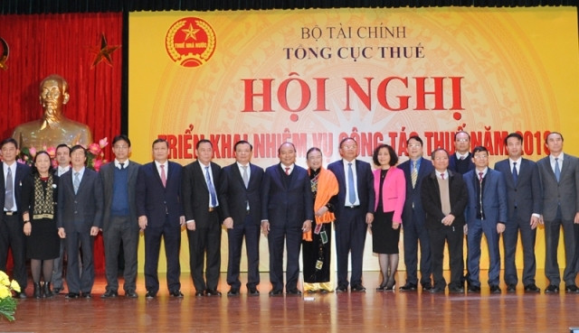  Conférence de l’Administration fiscale tenue le 31 janvier à Hanoi. Photo : Trân Hai/NDEL.