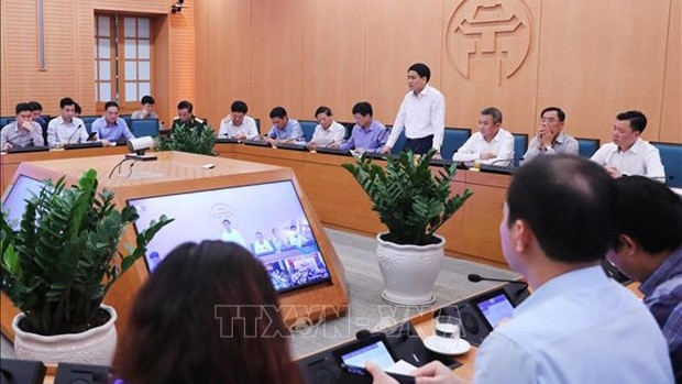 Lors d'une réunion de la Direction contre le Covid-19 de Hanoi. Photo : VNA.