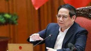 Le Premier ministre Pham Minh Chinh lors de la réunion, à Hanoi, le 1er juillet. Photo : VNA.