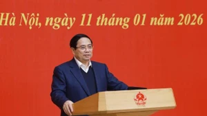 Le Premier ministre Pham Minh Chinh, également membre du Bureau politique, secrétaire du Comité du Parti du gouvernement, préside la conférence. Photo: VNA