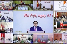 Le Premier ministre Pham Minh Chinh lors de la visioconférence avec 28 provinces et villes côtières, le 1er décembre. Photo : VNA. 
