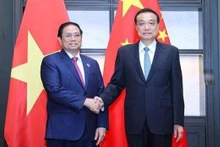 Le Premier ministre Pham Minh Chinh (à gauche) et son homologue chinoise Li Keqiang. Photo : VNA.