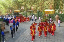 Une procession lors de la cérémonie de commémoration des rois Hùng. Photo : VNA