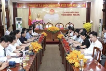 Des représentants de Binh Phuoc participant au webinaire. Photo: VNA