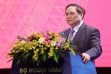 Le Premier ministre vietnamien Pham Minh Chinh s'exprime lors de la conférence. Photo : VNA