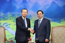 Le Premier ministre Pham Minh Chinh (à droite) et le président de la JETRO, Ishiguro Norihiko. Photo : VNA.