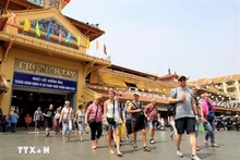 Touristes à Hô Chi Minh-Ville. Photo : VNA.