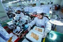Dans une société sud-coréenne située dans la zone industrielle de Yên Phong, province de Bac Ninh. Photo : VNA.