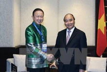 Le Président Nguyên Xuân Phuc (à droite) et le président de l'Association d'Amitié Thaïlande - Vietnam, Sanan Angubolkul. Photo : VNA.