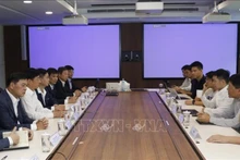 Le dialogue annuelle entre le ministère de la Sécurité publique du Vietnam et le ministère de l'Information et des Communications de Singapour, SNDGO et GovTech. Photo : VNA.
