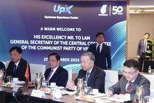 Le secrétaire général du Parti communiste du Vietnam (PCV), To Lam, travaille avec le groupe public malaisien d'énergie Petronas. Photo : VNA.