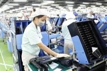 Dans l'usine de Canon Vietnam Co., Ltd - une entreprise à capitaux japonais, située à Hanoi. Photo : hanoimoi.com.vn