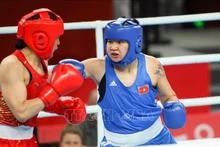 La boxeuse Luu Diêm Quynh (à droite) remporte la médaille de bronze pour le Vietnam. Photo: VNA