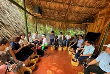 Dans le site de tourisme communautaire du hameau de Mien au district de Ba Vi. Photo : baoquocte.vn