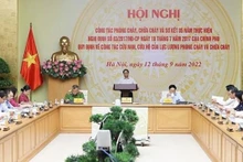 Le Premier ministre Pham Minh Chinh s'exprime lors de la conférence. Photo: VNA