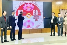 Cérémonie d'annonce du logo « Partenariat de la nouvelle ère » entre le Vietnam et Singapour. Photo : baoquocte.vn