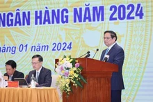 Le Premier ministre Pham Minh Chinh s'exprimant lors de la conférence sur le déploiement des tâches du secteur bancaire pour 2024. Photo : VNA. 