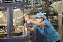La production industrielle reprend. Photo : VNA.