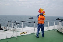Les garde-côtes vietnamienne et chinoise mènent leur 2e patrouille conjointe de l'année 2023. Photo: VNA