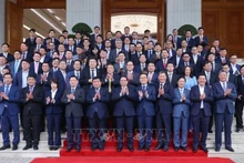 Le Premier ministre Pham Minh Chinh (au centre, première rangée) pose pour une photo de groupe lors de l’événement. Photo : VNA.