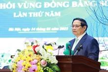 Le Premier ministre Pham Minh Chinh s'exprime lors de la 5e réunion du Conseil de coordination de la région du delta du fleuve Rouge. Photo : VNA.