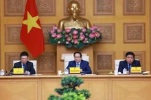 Le Premier ministre Pham Minh Chinh (centre) lors du dialogue avec le monde des affaires américain à Hanoi, le 13 mai. Photo : VNA.