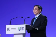 Le Premier ministre Pham Minh Chinh prend la parole au Sommet mondial sur l'action climatique dans le cadre de la COP26. Photo : VNA.