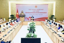 Le Premier ministre Pham Minh Chinh prend la parole lors de la rencontre. Photo : VNA.