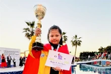 La Vietnamienne Nguyen Vu Bao Chau a remporté une médaille d’or dans le cadre des Championnats du monde de rapide et blitz de la jeunesse. Photo: tdtt.gov.vn