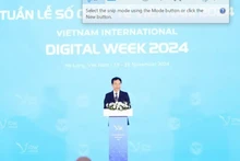 Le ministre de l'Information et de la Communication, Nguyên Manh Hung, s'exprime lorsd e l'ouvreture de la Semaine numérique internationale du Vietnam 2024. Photo: VietnamPlus