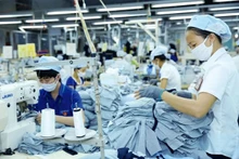 Le revenu moyen des travailleurs vietnamiens a augmenté de 6,9% en 2023. Photo : VNA.