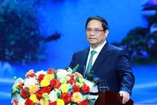 Le Premier ministre Pham Minh Chinh prend la parole lors de la conférence. Photo: VNA