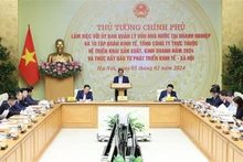 Le Premier ministre Pham Minh Chinh lors de la séance de travail avec le Comité de gestion de capitaux publics dans les entreprises et 19 groupes et compagnie générales relevant dudit Comité sur la production et les affaires en 2024 et sur la promotion des investissements pour le développement socio-économique. Photo : VNA.
