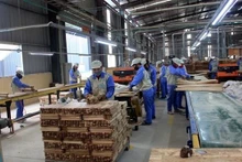 En 2024, l'industrie du bois fixe un objectif d'exportation de 15,2 milliards de dollars. Photo : VNA.