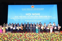 Lors de la Conférence sur la promotion des investissements de la province de Binh Dinh 2024. Photo: NDEL
