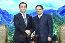 Le Premier ministre Pham Minh Chinh (droite) et Muraoka Tsugumasa, gouverneur de la préfecture japonaise de Yamaguchi. Photo : VNA.