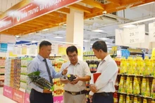 Des produits vietnamiens présentés dans un supermarché. Photo d'illustration : VNA.