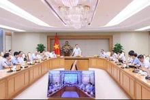 Le vice-Premier ministre Trân Hông Hà s’adressant à la réunion en format hybride . Photo: VNA