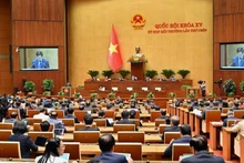 Lors d'une séance de travail de l’Assemblée nationale du Vietnam dans le cadre de sa 9e session extraordinaire. Photo: daibieunhandan.vn